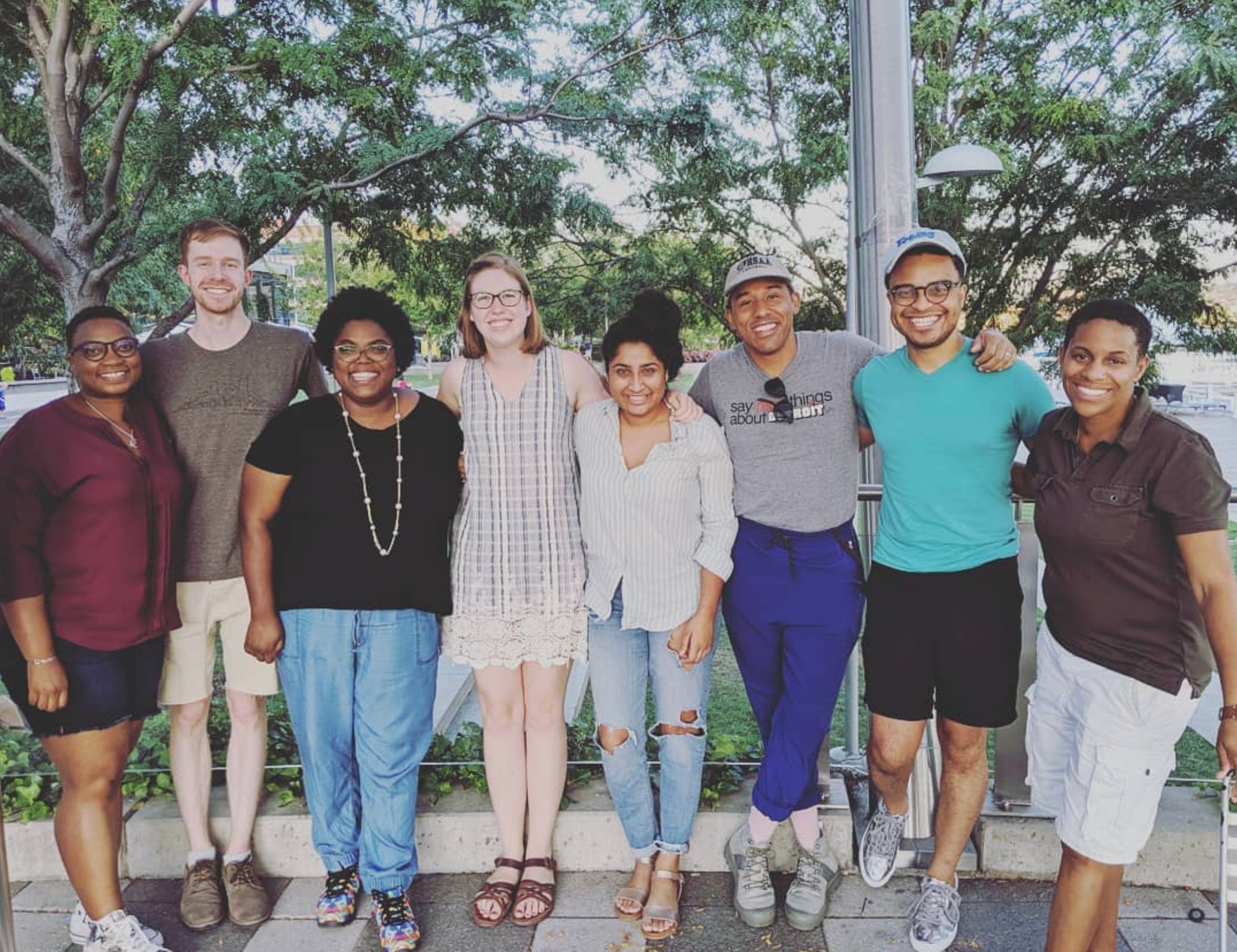 A group from The Table stands together outdoors.