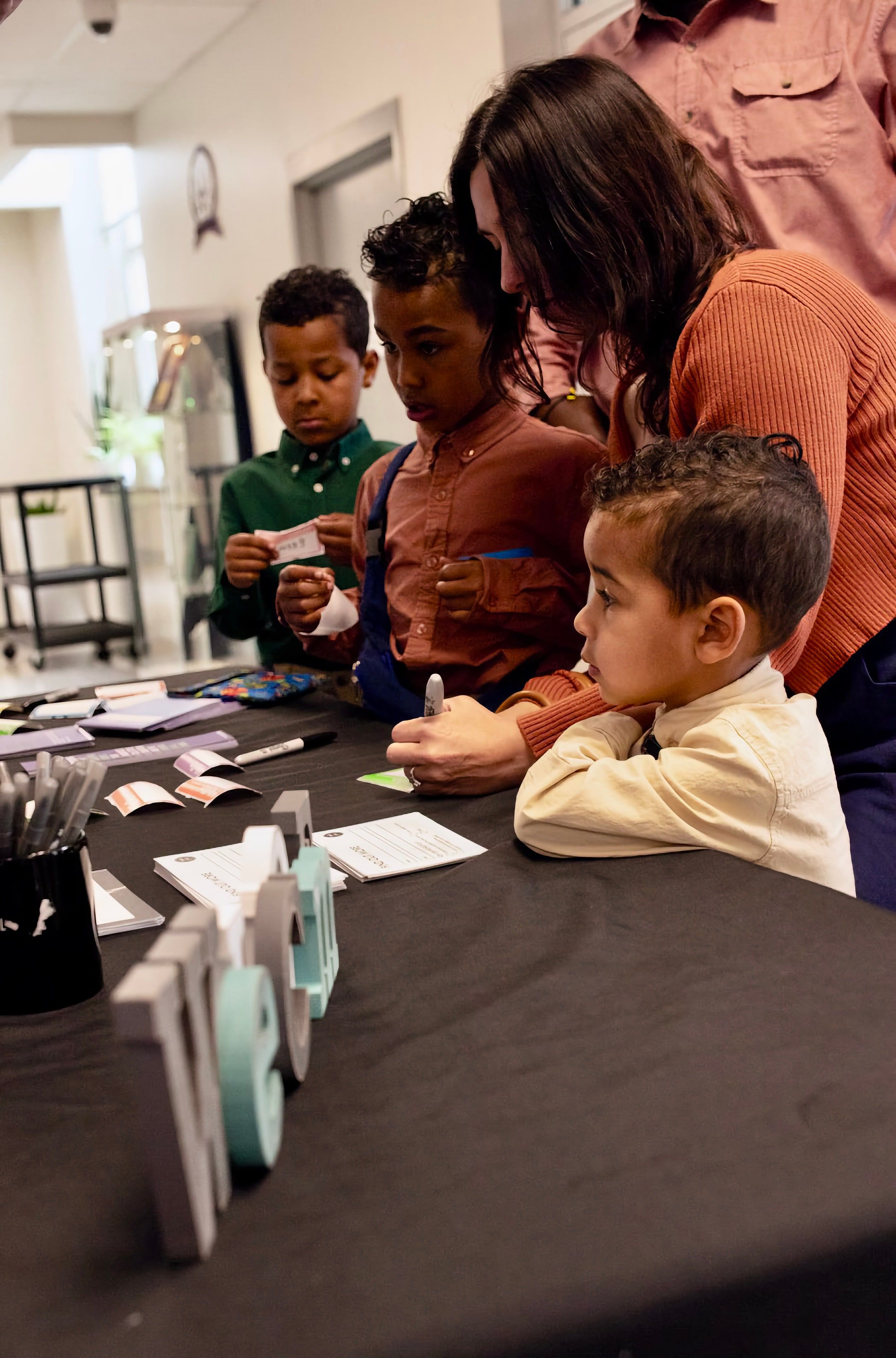 A parent and child at the welcome table on a Sunday.