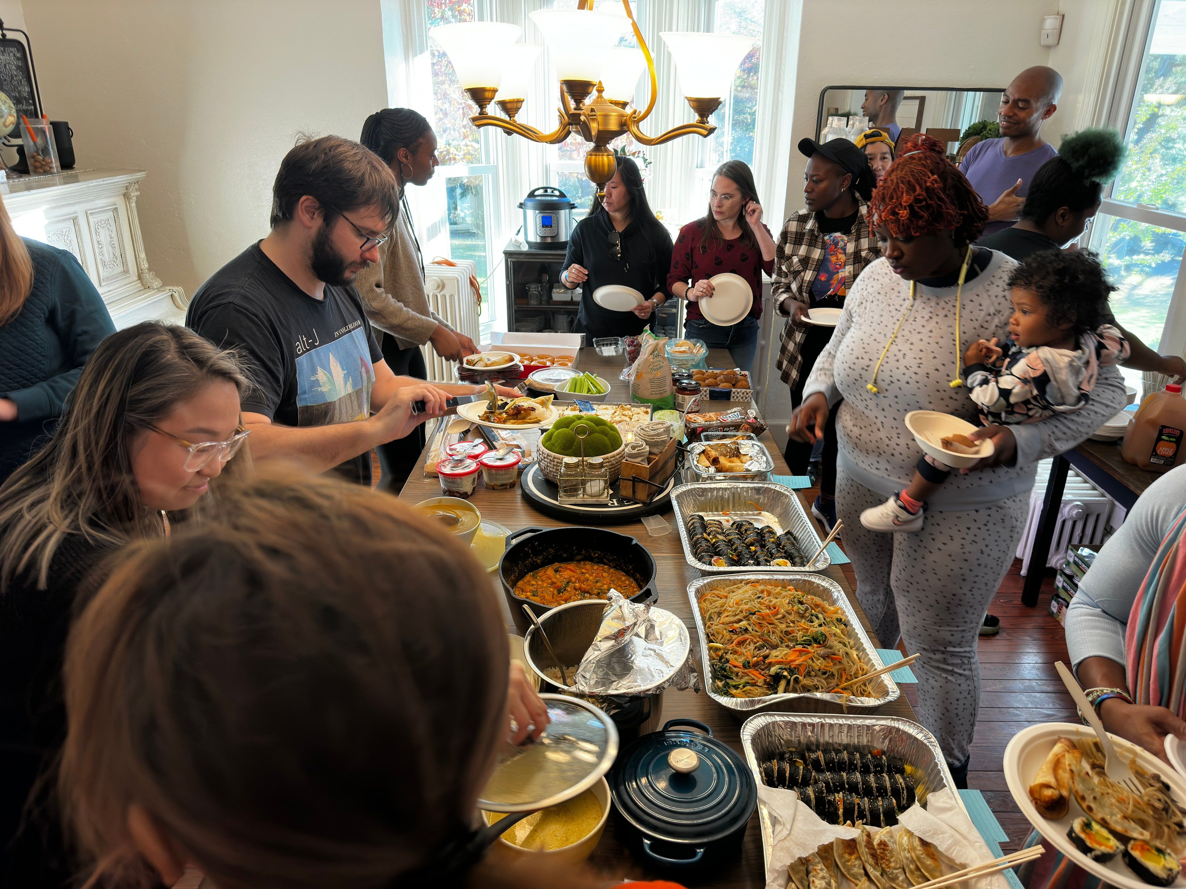 Church members serve each other at a potluck.